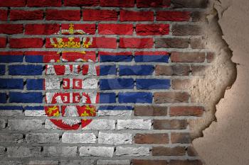 Dark brick wall texture with plaster - flag painted on wall - Serbia