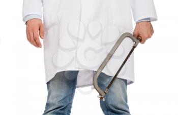 Crazy doctor is holding a big saw in his hands, isolated on white