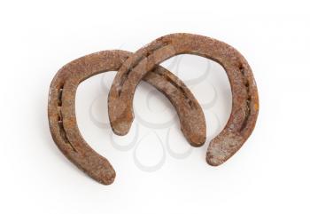 Old rusty horseshoes, isolated on a white background