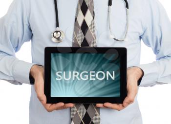 Doctor, isolated on white backgroun,  holding digital tablet - Surgeon