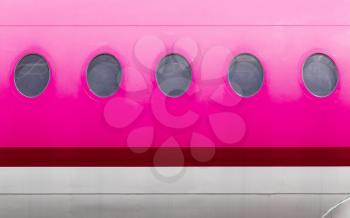 Windows of the pink airplane - copy space