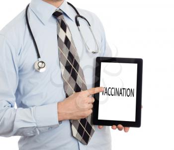 Doctor, isolated on white backgroun,  holding digital tablet - Vaccination