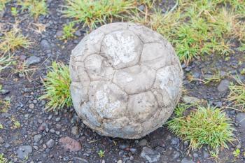 Old football isolated, used by a dog