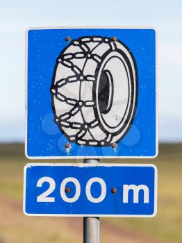 Real Icelandic traffic sign indicating that snow chains are required
