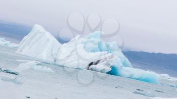 Jokulsarlon is a large glacial lake in southeast Iceland - Ice breaking of a glacier