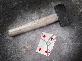 Hammer with a broken card, vintage look, four of diamonds