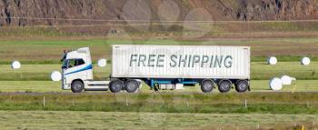 White trruck driving through a rural area - Free shipping