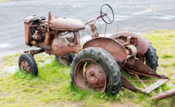 Old abandoned tractor in a field on Iceland