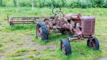 Old abandoned tractor in a field on Iceland