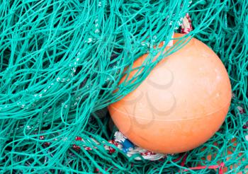 Abstract background with a pile of fishing nets ready to be cast overboard for a new days fishing