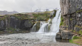 Kirkjufellsfoss waterfall near the Kirkjufell mountain on the north coast of Iceland's Snaefellsnes peninsula