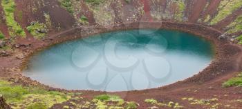 Kerid is a beautiful crater lake of a turquoise color located on the South-West of Iceland