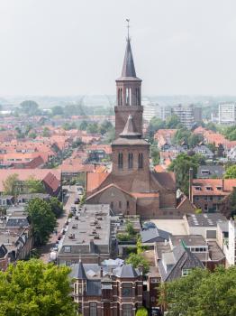 LEEUWARDEN, NETHERLANDS - MAY 28, 2016: View of a part of Leeuwarden with a big church on may 28, 2016.