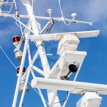 Mast of a modern ship with a horn, lamps and other equipment - Selective focus