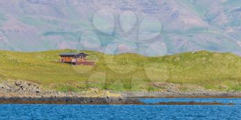 Single house on an small island at the westcoast of Iceland