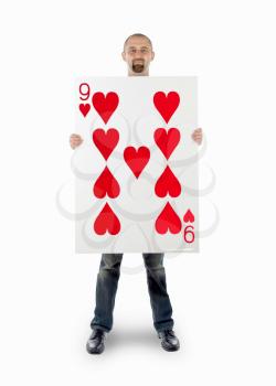 Businessman with large playing card - Nine of hearts