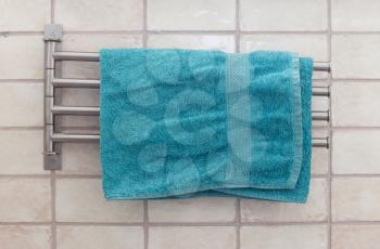 Metal towel rack in a modern bathroom