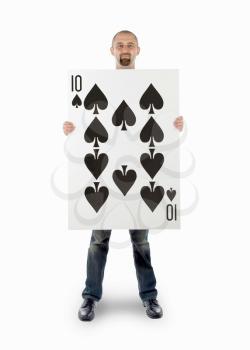 Businessman with large playing card - Ten of spades