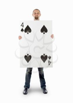 Businessman with large playing card - Four of spades