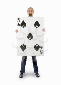 Businessman with large playing card - Five of spades