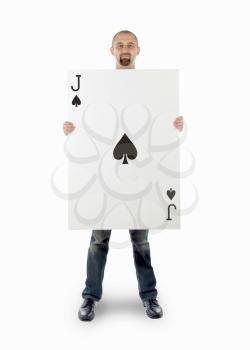 Businessman with large playing card - Jack of spades