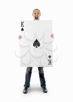 Businessman with large playing card - King of spades