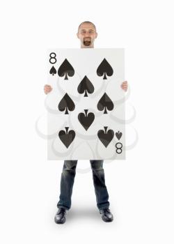 Businessman with large playing card - Eight of spades