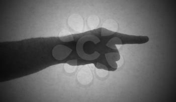 Silhouette behind a transparent paper - Finger pointing