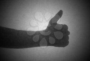 Silhouette behind a transparent paper - Thumbs up