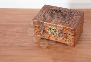Very old wooden chest with simple lock, selective focus