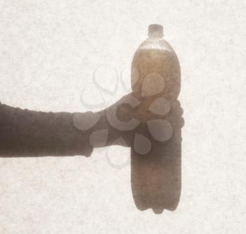 Silhouette behind a transparent paper - Bottle of soda