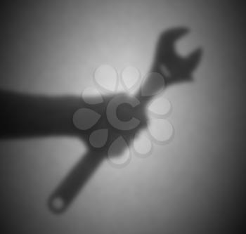 Silhouette behind a transparent paper - Blurred - English wrench