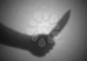 Silhouette behind a transparent paper - Blurred - Knife threat