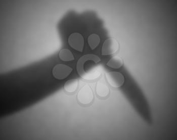 Silhouette behind a transparent paper - Blurred - Knife threat