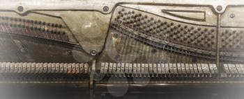 Inside of a piano, dusty and scratched, vintage