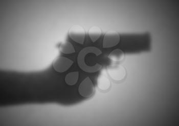 Silhouette behind a transparent paper - Blurred - Hand gun