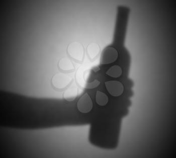 Silhouette behind a transparent paper - Blurred - Bottle of wine