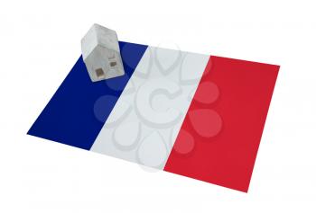 Small house on a flag - Living or migrating to France