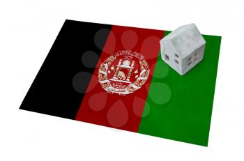 Small house on a flag - Living or migrating to Afghanistan