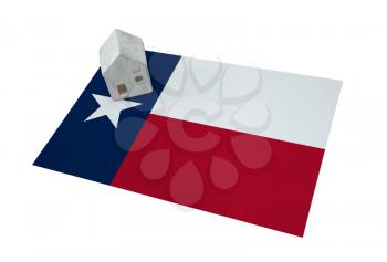 Small house on a flag - Living or migrating to Texas