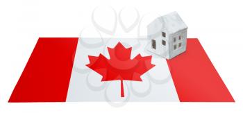 Small house on a flag - Living or migrating to Canada