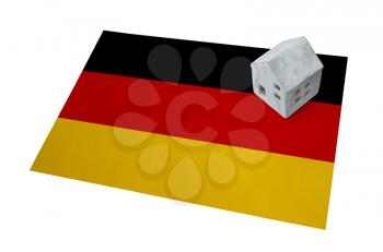 Small house on a flag - Living or migrating to Germany