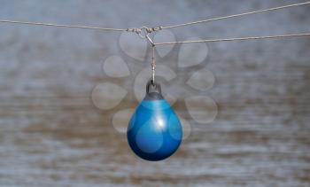 BLue buoy hanging out to dry, selective focus