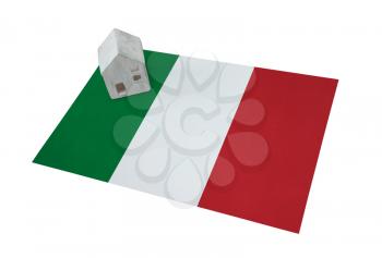 Small house on a flag - Living or migrating to Italy
