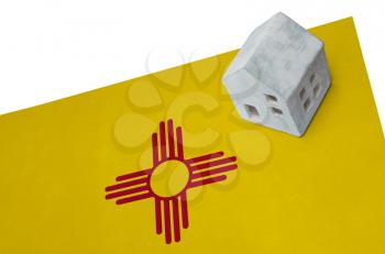 Small house on a flag - Living or migrating to New Mexico