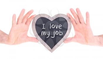Adult holding heart shaped chalkboard - Isolated on white - Love my job