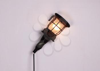 Old vintage light from the 70s, hanging on wall, isolated