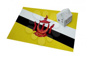 Small house on a flag - Living or migrating to Brunei