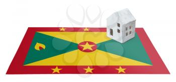 Small house on a flag - Living or migrating to Grenada