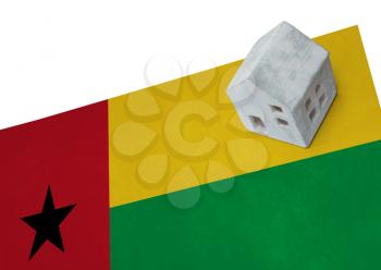 Small house on a flag - Living or migrating to Guinea Bissau